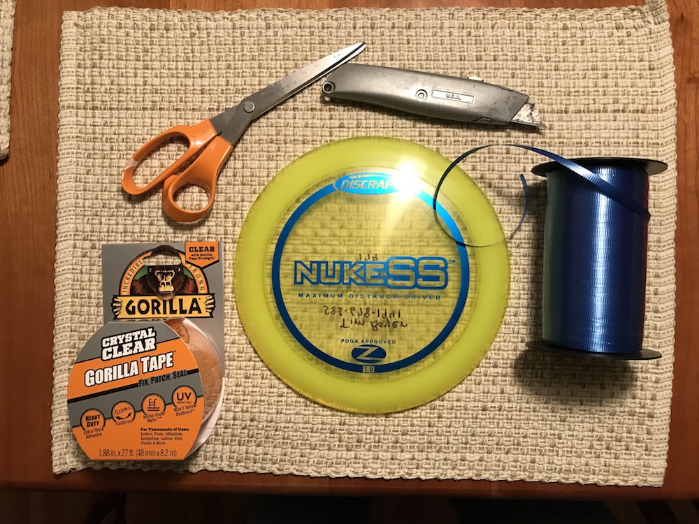 Materials for adding ribbons to discs playing for disc golf in deep snow.
