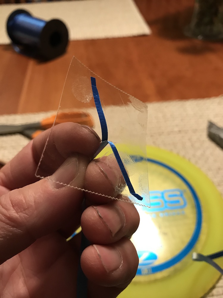 Insert split ribbon through slit in tape.
